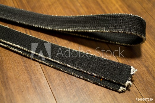 Picture of Black belt of martial arts on the floor